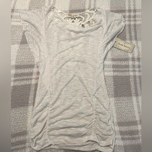 White top NWT size small. Lace pattern on back. Derek Heart